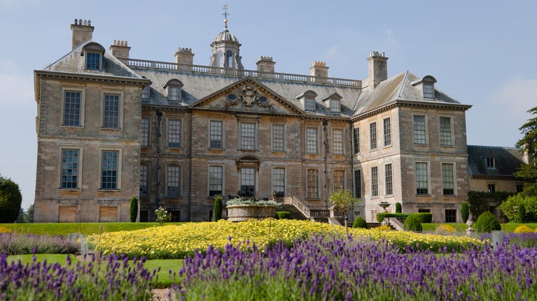 North front of Belton House with lavender blooming in the Dutch Gardens